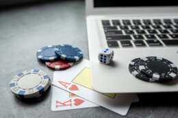 Casino,Chips,And,Playing,Cards,On,Laptop,Notebook.,Poker,Game