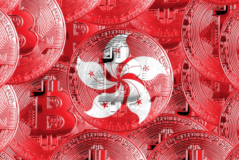 Holding,A,Physical,Version,Of,Bitcoin,And,The,Flag,Of Holding,A,Physical,Version,Of,Bitcoin,And,The,Flag,Of