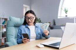 Successful,Asian,Business,Woman,Is,Happy,With,Winning,In,Online