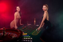 Photo,Two,Seductive,Lady,Playing,Poker,On,Casino,Table,With