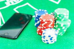 Casino,Chip,And,Phone,On,The,Table,In,Casino,Concept